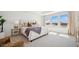 Spacious primary bedroom with tray ceiling, large windows, and stylish decor at 8030 W Griswold Rd, Peoria, AZ 85345