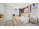 Charming bedroom with a window seat, cozy bedding, and a decorative accent wall, perfect for relaxing at 8030 W Griswold Rd, Peoria, AZ 85345
