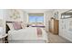 Cozy bedroom with a window seat, plush bedding, and a relaxing atmosphere at 8030 W Griswold Rd, Peoria, AZ 85345