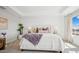 Beautiful bedroom with tray ceiling, large windows, and stylish decor at 8030 W Griswold Rd, Peoria, AZ 85345