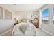 Comfortable bedroom features natural light, minimalist decor, and cozy textures at 8030 W Griswold Rd, Peoria, AZ 85345
