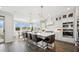 Bright kitchen with a large island, stainless appliances, pendant lights and connection to the dining area at 8030 W Griswold Rd, Peoria, AZ 85345