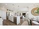 Open kitchen with a large island, stainless steel appliances, and open access to a dining and living space at 8030 W Griswold Rd, Peoria, AZ 85345