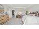 Spacious primary bedroom with tray ceiling, large windows, and stylish decor at 8030 W Griswold Rd, Peoria, AZ 85345