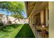 Enjoy outdoor living with a spacious yard, patio, and a pool with mature landscaping at 8910 E Topeka Dr, Scottsdale, AZ 85255