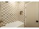 Elegant bathroom featuring a tiled shower with niche and a classic tub at 8910 E Topeka Dr, Scottsdale, AZ 85255