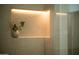 Bathroom with a niche that is highlighted with accent lighting at 8910 E Topeka Dr, Scottsdale, AZ 85255