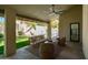 Entertain guests on the patio with views of the pool and a lush green yard at 8910 E Topeka Dr, Scottsdale, AZ 85255