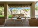 Relax on the patio with a comfortable seating area and views of the pool and yard at 8910 E Topeka Dr, Scottsdale, AZ 85255