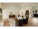 Open living room featuring hardwood floors, fireplace, and modern decor at 8910 E Topeka Dr, Scottsdale, AZ 85255