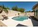 Cool off in this pool surrounded by lush landscaping and mature palm trees at 8910 E Topeka Dr, Scottsdale, AZ 85255