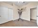 Bedroom featuring neutral carpet and sliding door closet, providing ample storage space at 8968 W Adam Ave, Peoria, AZ 85382