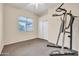 Bedroom with carpet flooring, a ceiling fan, and exercise equipment, perfect for a home gym at 8968 W Adam Ave, Peoria, AZ 85382