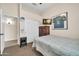 Bedroom featuring a ceiling fan, closet doors and a framed jersey on the wall at 8968 W Adam Ave, Peoria, AZ 85382