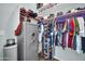 Walk-in closet with built-in shelving, clothing racks and a gun safe at 8968 W Adam Ave, Peoria, AZ 85382