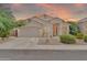 Charming single-story home with a two-car garage and low-maintenance desert landscaping at 8968 W Adam Ave, Peoria, AZ 85382