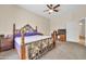 Primary bedroom featuring a wrought iron bed frame and ceiling fan at 8968 W Adam Ave, Peoria, AZ 85382