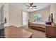 Primary bedroom with a bed, ceiling fan, and an ensuite bathroom at 8968 W Adam Ave, Peoria, AZ 85382