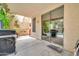 Covered patio with BBQ and pool access, perfect for entertaining at 8968 W Adam Ave, Peoria, AZ 85382