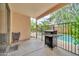 Covered patio with BBQ area and access to a sparkling pool, ideal for outdoor living at 8968 W Adam Ave, Peoria, AZ 85382