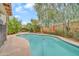 Backyard oasis showcasing a private swimming pool with mature landscaping, offering a peaceful retreat at 8968 W Adam Ave, Peoria, AZ 85382