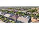 Picturesque aerial view of a suburban neighborhood featuring neatly arranged homes and green spaces at 9764 E Thornbush Ave, Mesa, AZ 85212