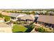 An aerial view of a single-Gathering home showcasing manicured landscaping, backyard patios, and outdoor seating at 9764 E Thornbush Ave, Mesa, AZ 85212