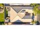 Aerial rooftop view of a single-Gathering home showcasing the roofline, backyard hardscape, and landscaping at 9764 E Thornbush Ave, Mesa, AZ 85212