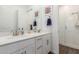 Bright bathroom features a double sink vanity with white countertop and modern fixtures and walk-in shower at 9764 E Thornbush Ave, Mesa, AZ 85212