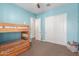 This bedroom features bunk beds, neutral carpet, and a closet with sliding doors at 9764 E Thornbush Ave, Mesa, AZ 85212