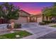 Spacious home with a three-car garage and a well-maintained front yard at 9764 E Thornbush Ave, Mesa, AZ 85212