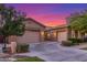 Spacious home with a three-car garage and a well-maintained front yard at 9764 E Thornbush Ave, Mesa, AZ 85212