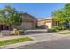 Spacious home with a three-car garage and a well-maintained front yard at 9764 E Thornbush Ave, Mesa, AZ 85212