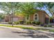 Charming single-story home featuring lush landscaping and a well-manicured lawn at 9764 E Thornbush Ave, Mesa, AZ 85212