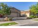 Spacious home with a three-car garage and a well-maintained front yard at 9764 E Thornbush Ave, Mesa, AZ 85212