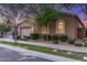 Charming single-story home featuring lush landscaping and a well-manicured lawn at 9764 E Thornbush Ave, Mesa, AZ 85212