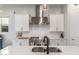 Close up of a bright and modern kitchen with stainless steel appliances and plenty of counter space at 9764 E Thornbush Ave, Mesa, AZ 85212