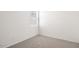 Unfurnished bedroom featuring neutral carpeting and a window, ready for personalization at 10608 W Sonrisas St, Tolleson, AZ 85353