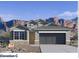 Charming single Gathering home with a two-car garage and attractive stone accents at 10608 W Sonrisas St, Tolleson, AZ 85353