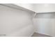 Walk-in closet with shelf and rod system at 10608 W Sonrisas St, Tolleson, AZ 85353