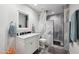 Modern bathroom featuring a stylish vanity, mirror, and sleek shower with elegant tile work at 11256 E Sunnyside Dr, Scottsdale, AZ 85259