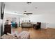 Cozy living space features hardwood floors, neutral paint, comfortable seating, and a large entertainment area at 11256 E Sunnyside Dr, Scottsdale, AZ 85259