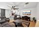 Relaxing living room features tile floors, neutral paint, comfortable seating, and a large entertainment area at 11256 E Sunnyside Dr, Scottsdale, AZ 85259