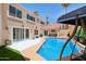 Gorgeous backyard with a sparkling pool, covered patio, and ample space for outdoor relaxation at 11256 E Sunnyside Dr, Scottsdale, AZ 85259