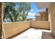 An empty outdoor balcony provides a relaxing space with views of the surrounding trees and blue sky at 1126 W Elliot Rd # 2023, Chandler, AZ 85224