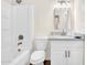 Bright bathroom featuring a shower-tub, toilet, and a sink with modern fixtures and a stylish mirror at 1126 W Elliot Rd # 2023, Chandler, AZ 85224