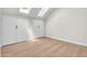 Bright bedroom with two skylights above and featuring light wood floors and double closets at 1126 W Elliot Rd # 2023, Chandler, AZ 85224