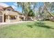 Charming condo complex featuring well-maintained landscaping and mature shade trees at 1126 W Elliot Rd # 2023, Chandler, AZ 85224