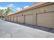 Exterior shot of garages offering parking and storage for residents, numbered for easy identification at 1126 W Elliot Rd # 2023, Chandler, AZ 85224