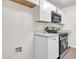 Well-equipped kitchen featuring stainless appliances, stylish countertops, and white cabinetry at 1126 W Elliot Rd # 2023, Chandler, AZ 85224